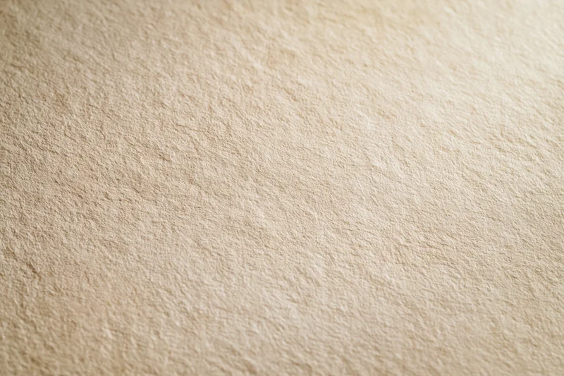 Aged cream paper texture filling the frame in flat lay view