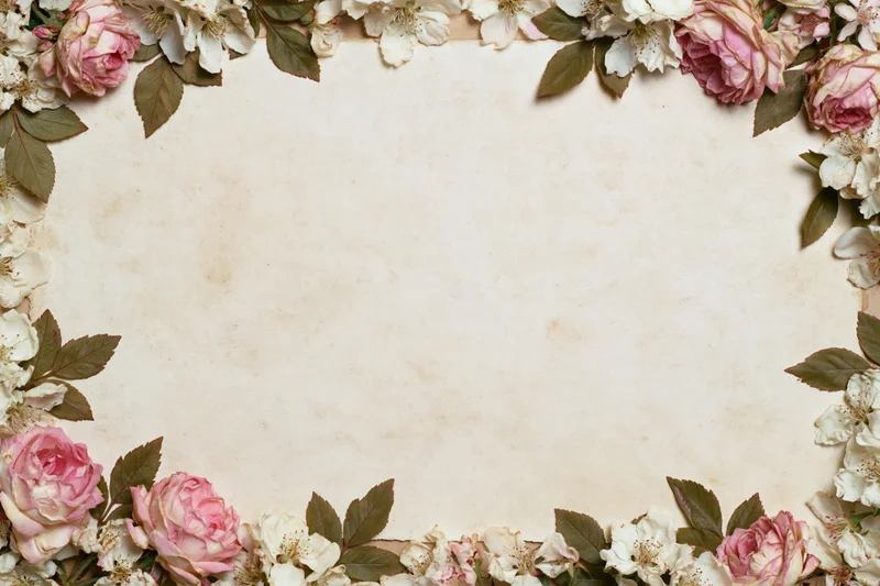 Floral border of pink and white roses on aged paper background with central copyspace