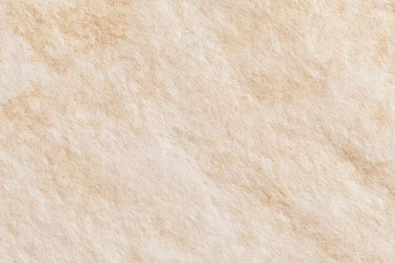 Aged plaster wall surface with textured beige finish filling the frame
