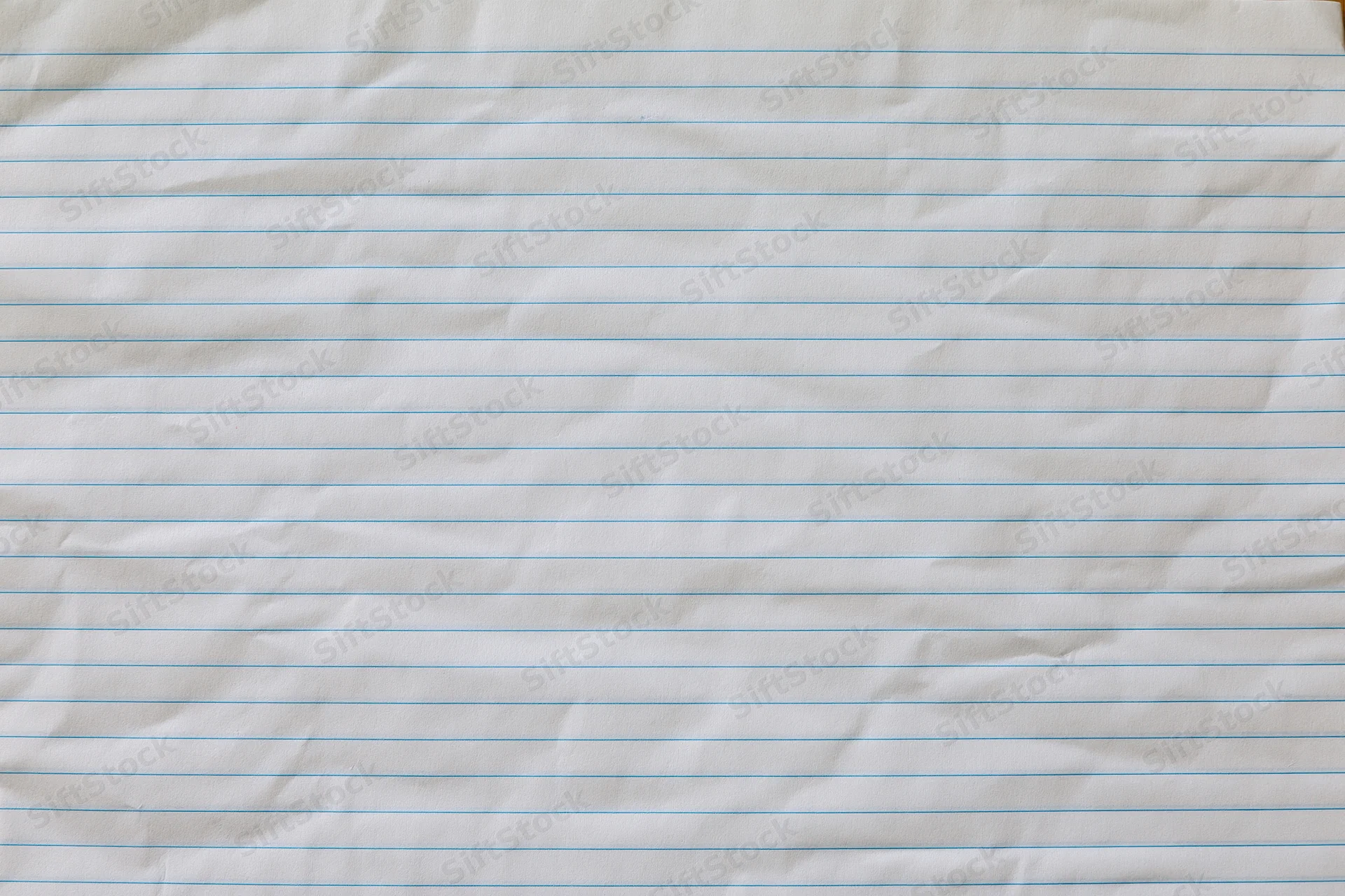 Crumpled lined notebook paper filling the frame as a textured background with copy space