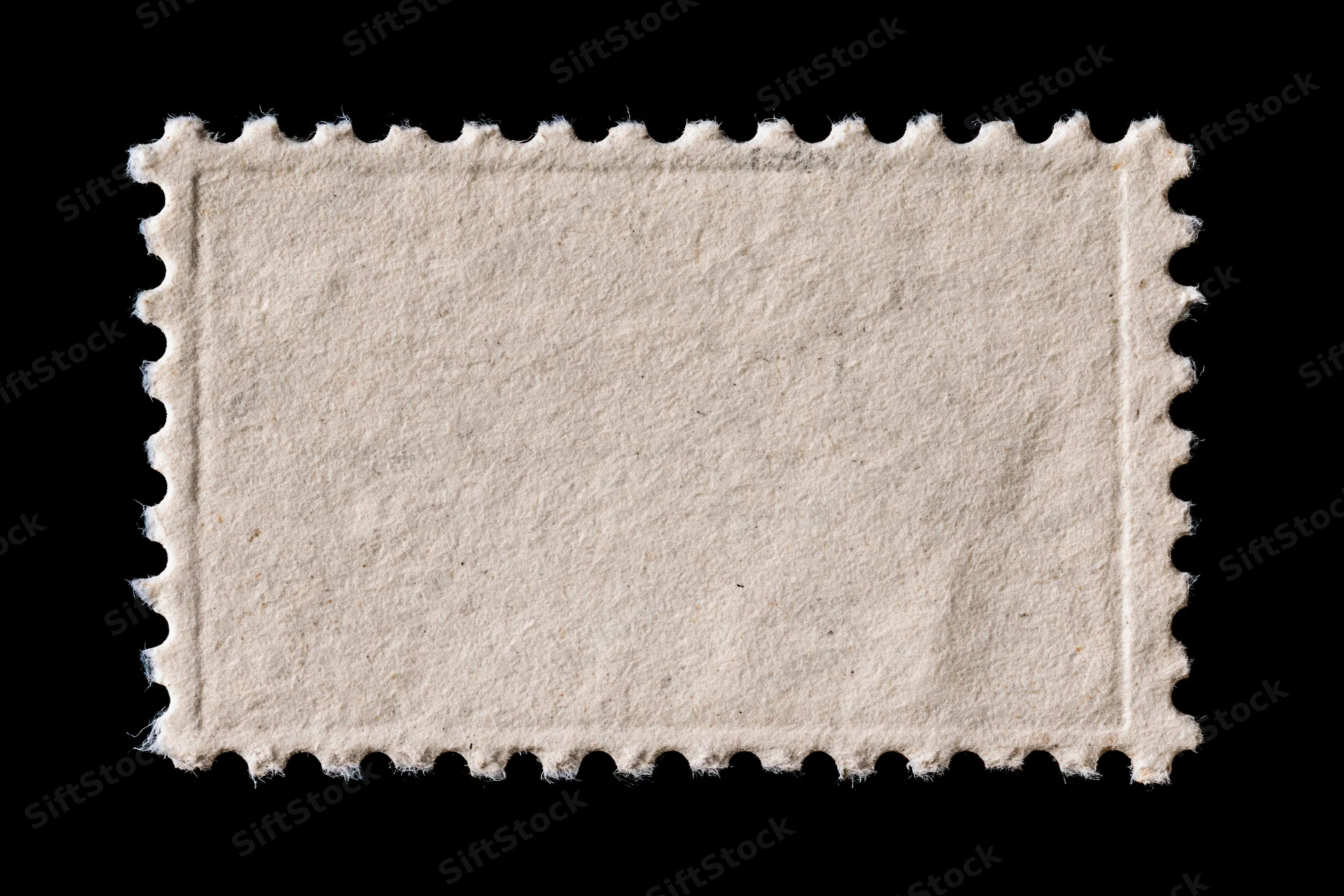 Blank postage stamp with perforated edges on black background