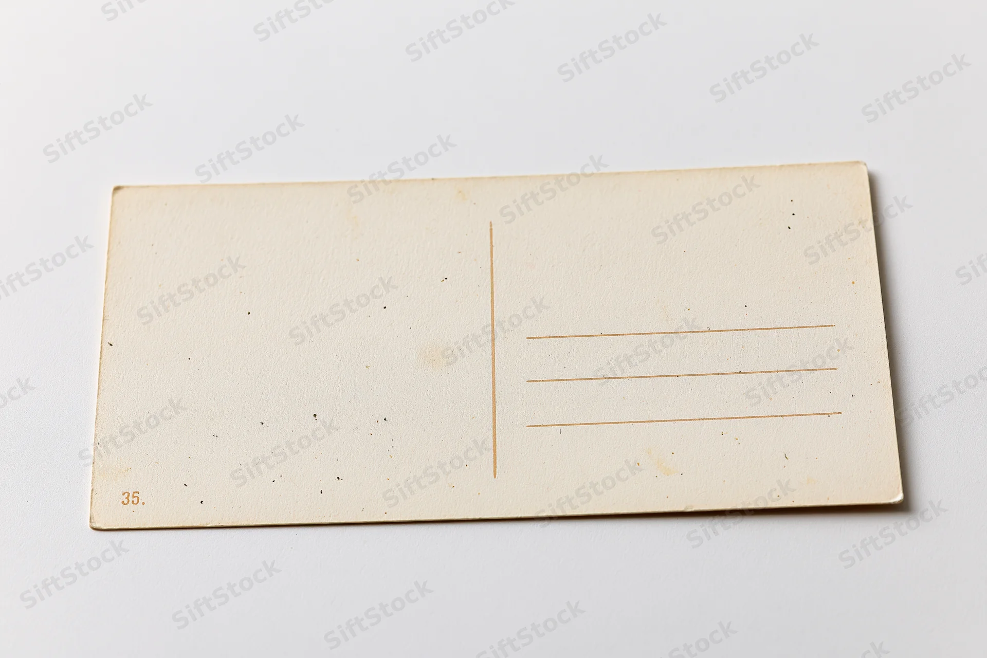 Vintage blank postcard back side lying flat on white surface