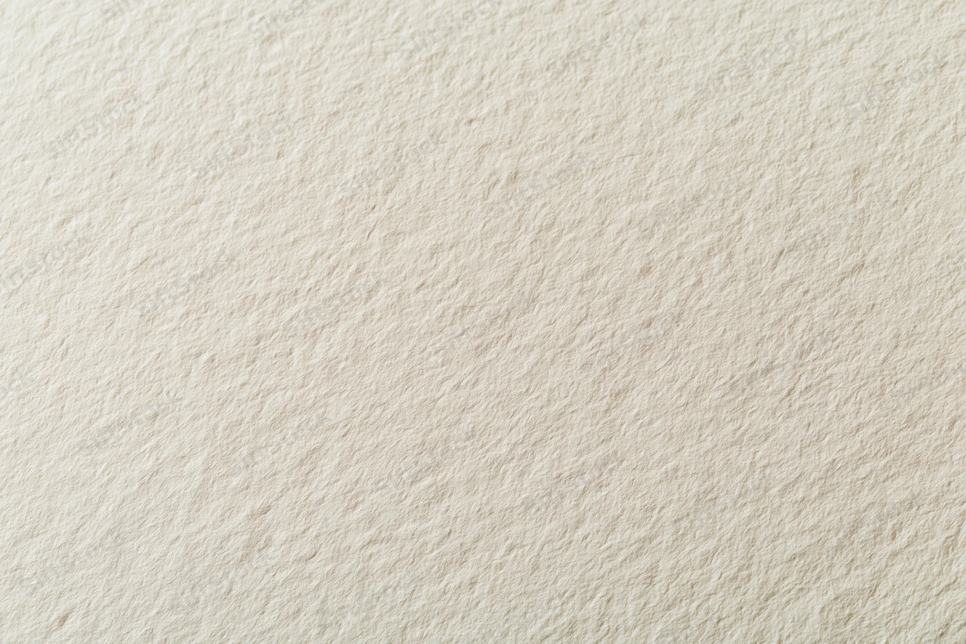 Close-up of a blank sheet of watercolor paper showing its textured surface