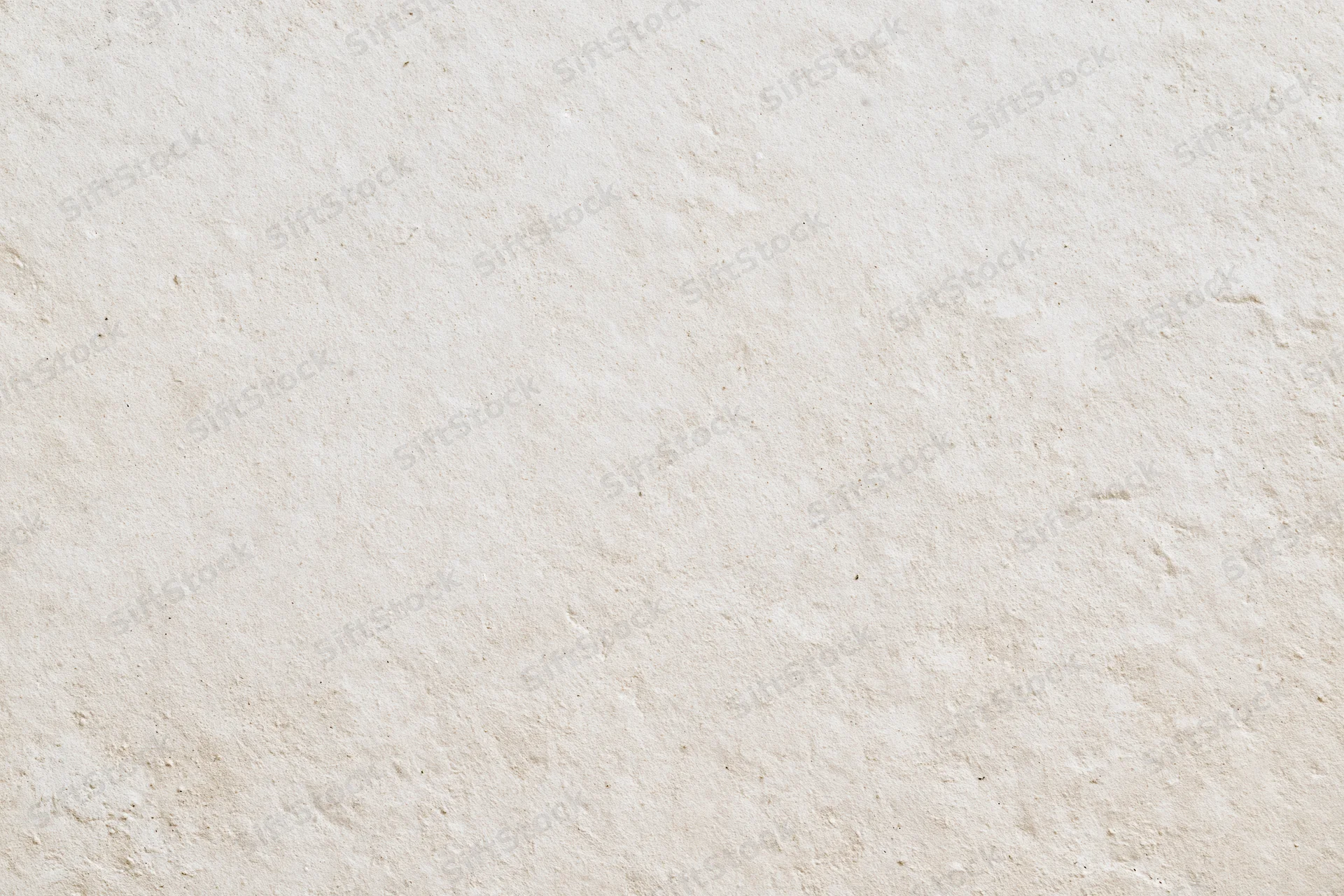 Close-up of a smooth beige plaster wall surface