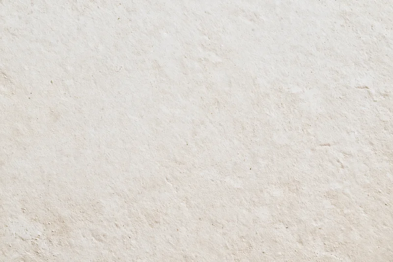 Close-up of a smooth beige plaster wall surface