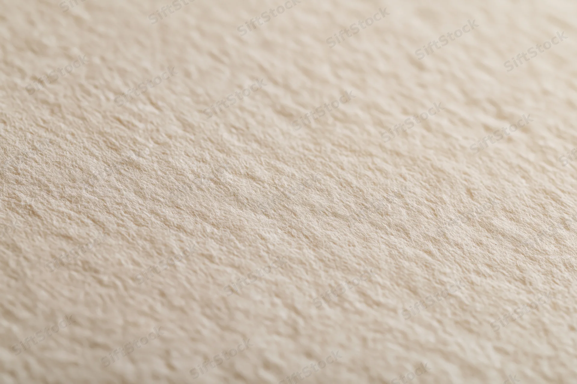 Close-up of aged cream-white paper surface with textured grain filling the frame