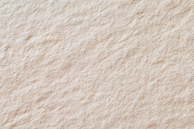 Close-up flat lay of aged paper surface filling frame