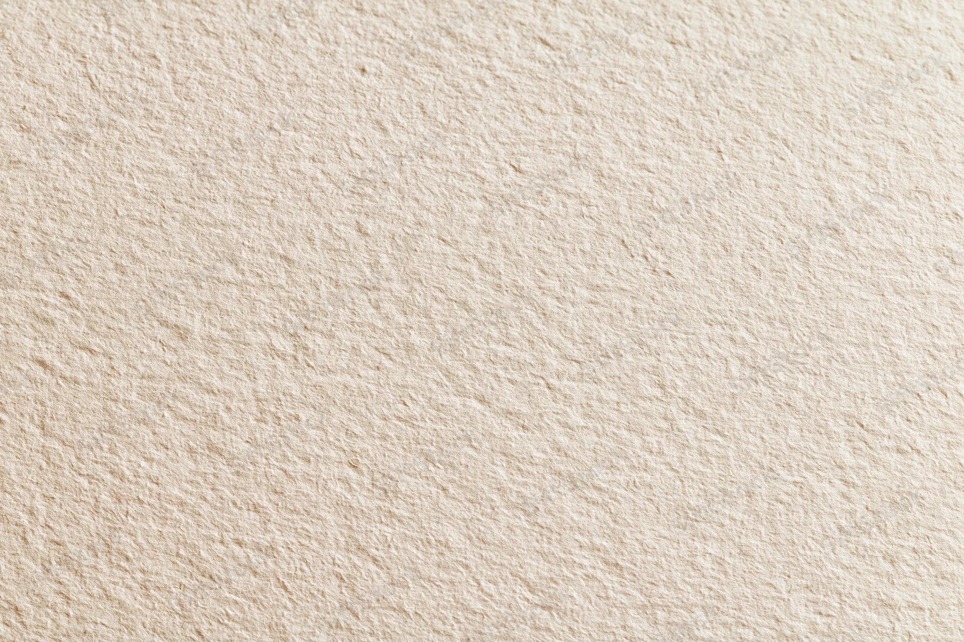 Close-up of blank white watercolor paper with textured surface filling the frame