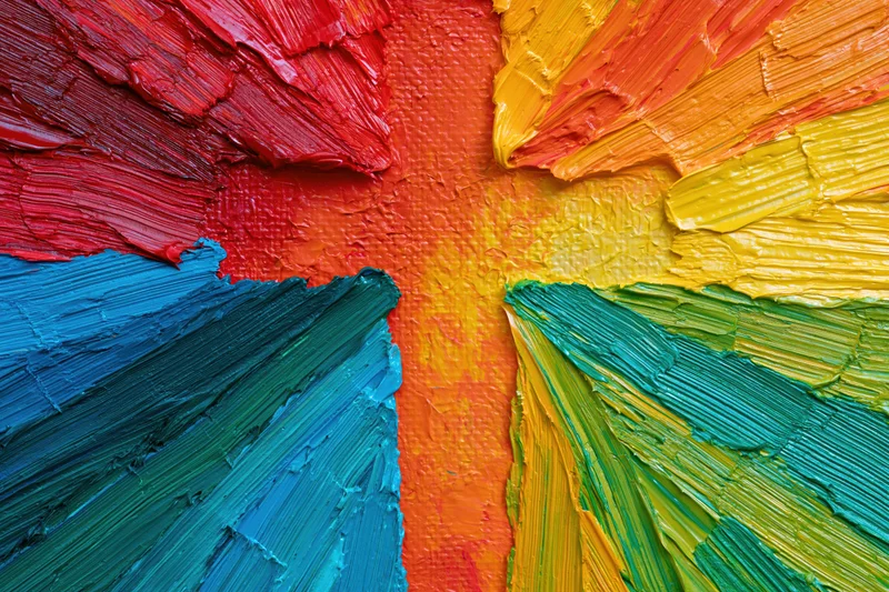 Close-up of thick impasto oil painting with vibrant rainbow colors on canvas