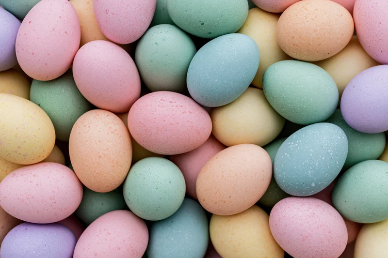 Pastel-colored dyed easter eggs densely packed filling the frame