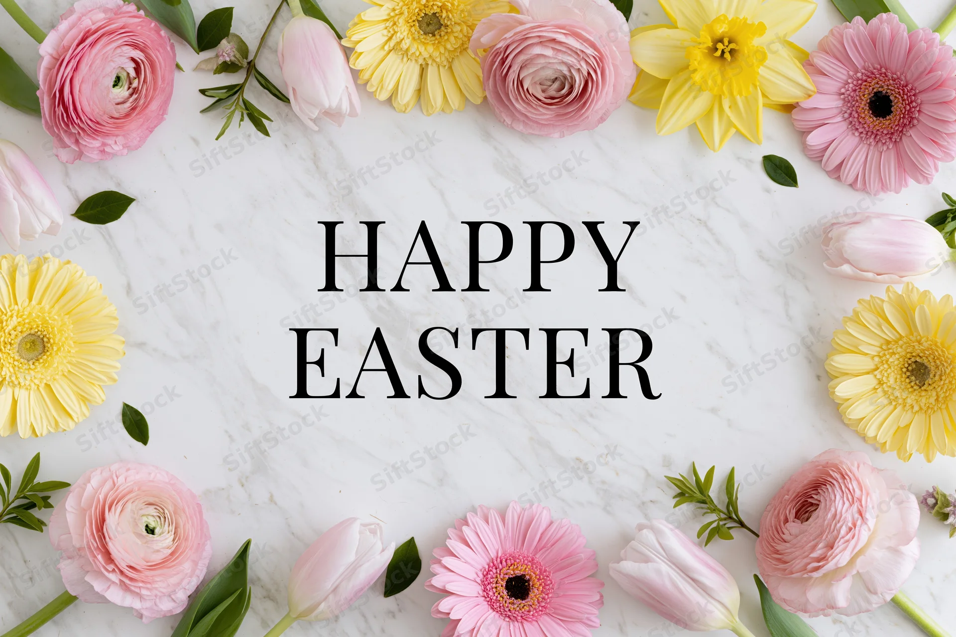 Spring flowers arranged around bold serif text on marble surface
