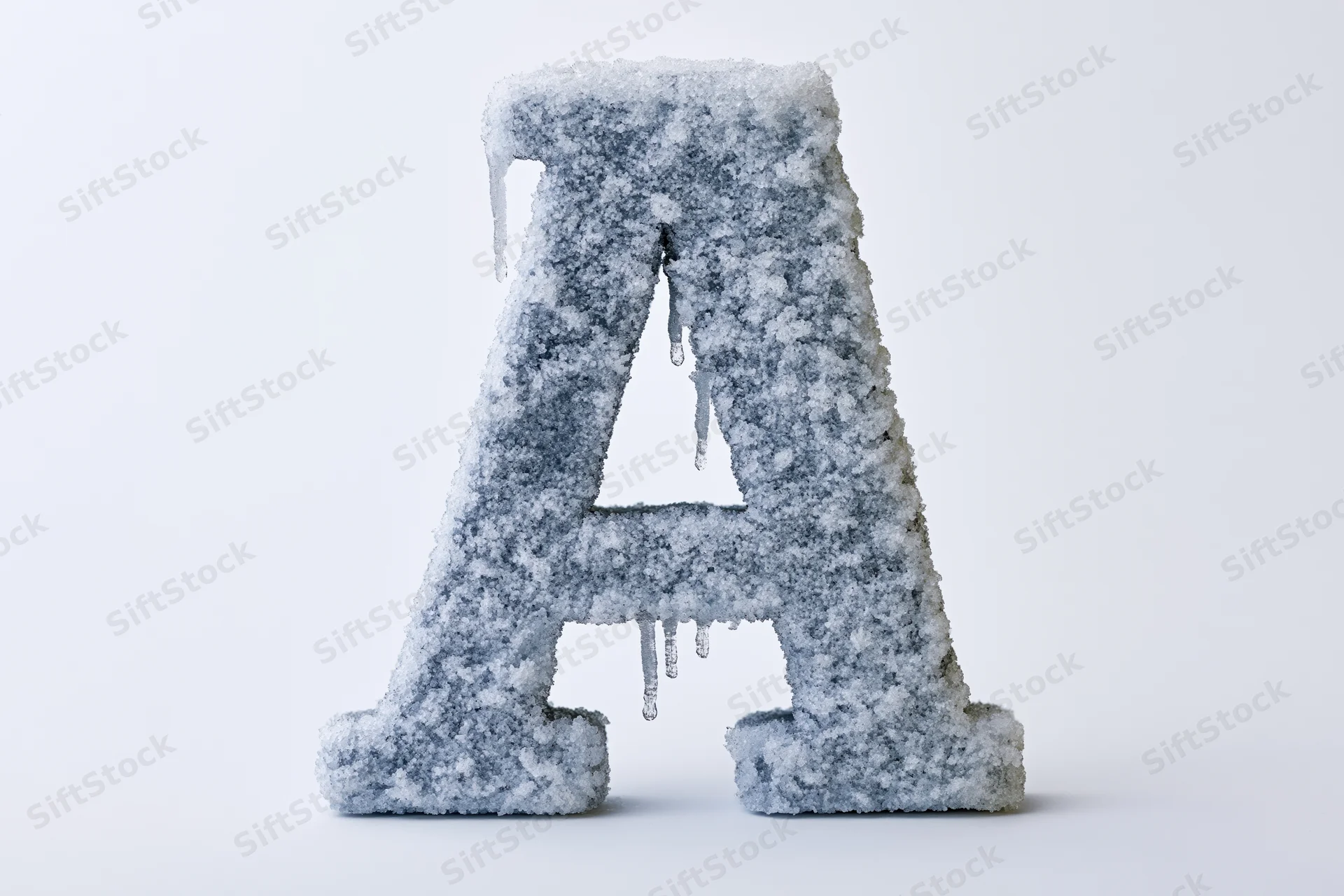 Frost-covered capital letter A with icicles hanging on a white background