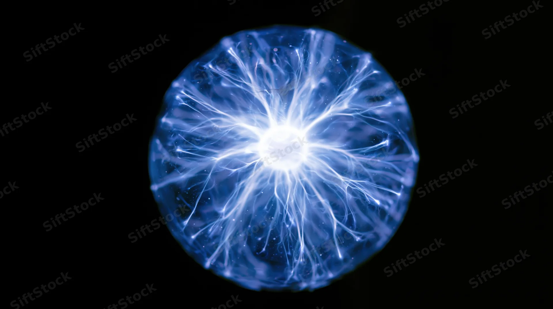 Plasma discharge sphere glowing with electric filaments in a vacuum glass bulb