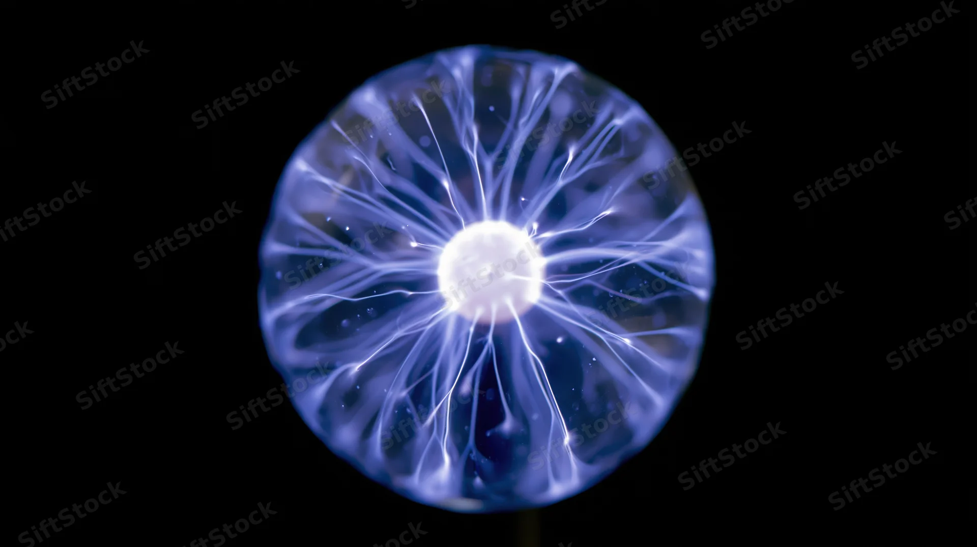 Plasma sphere glowing with electric filaments against black background