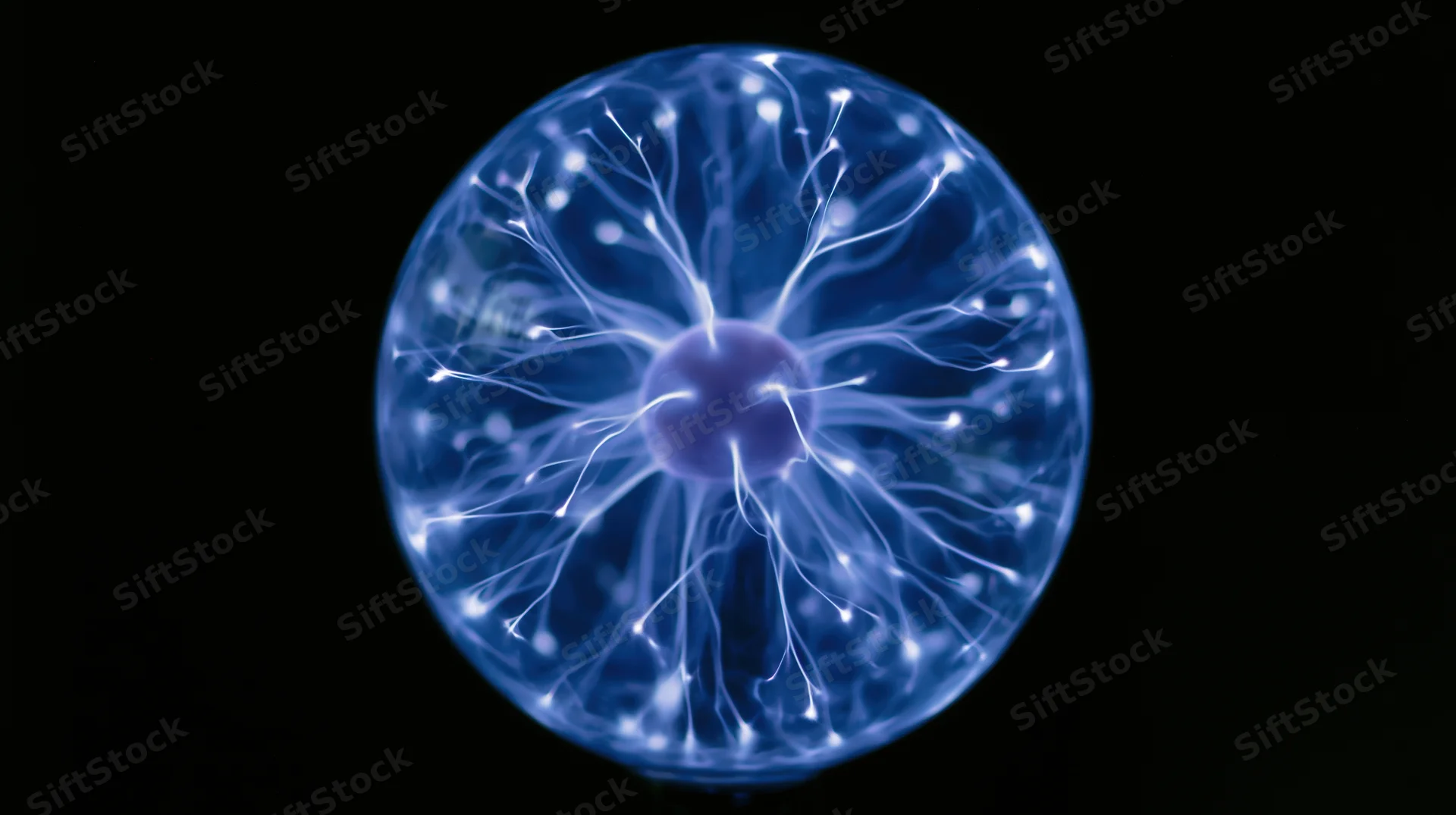 Glowing plasma ball with electric filaments against black background