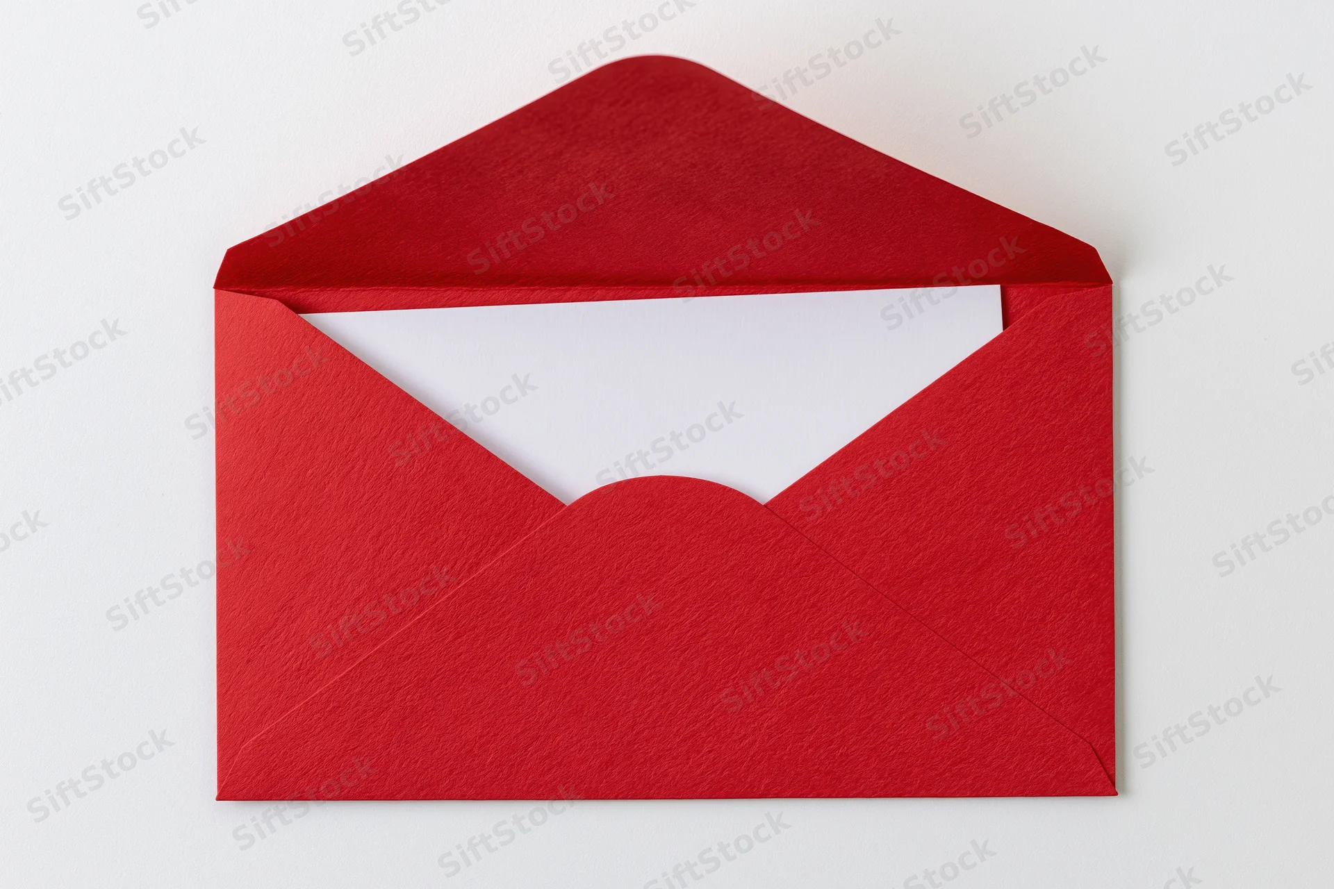 Open red paper envelope with blank white card inside, flat lay on white background