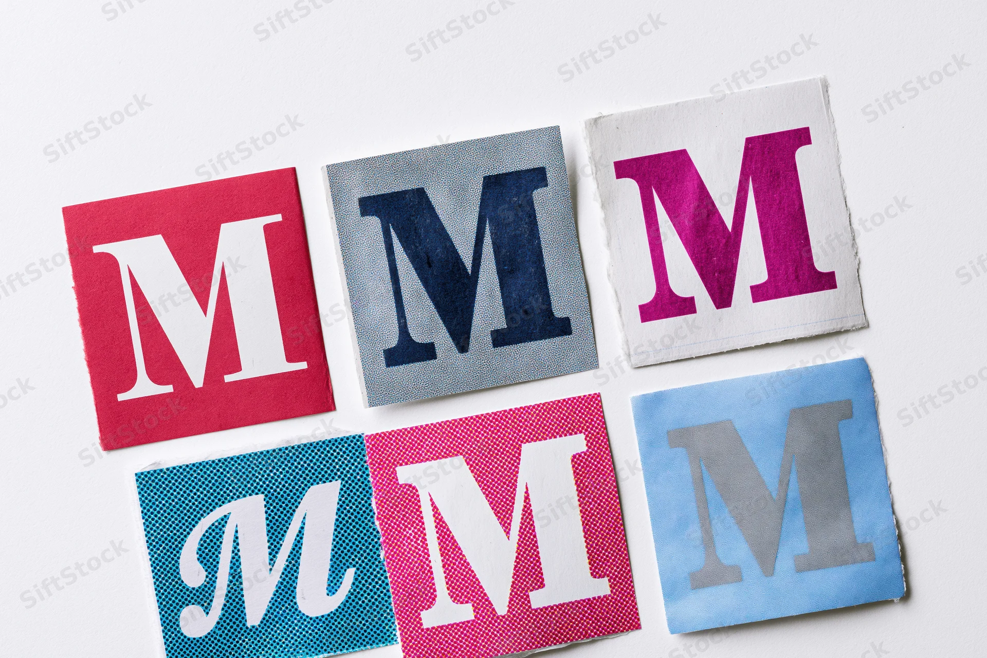 Six cut-out letter m squares arranged in a grid on white background