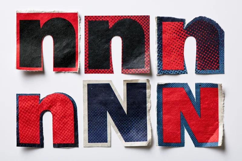Six cut-out letter n and N clippings arranged in a grid on a white background