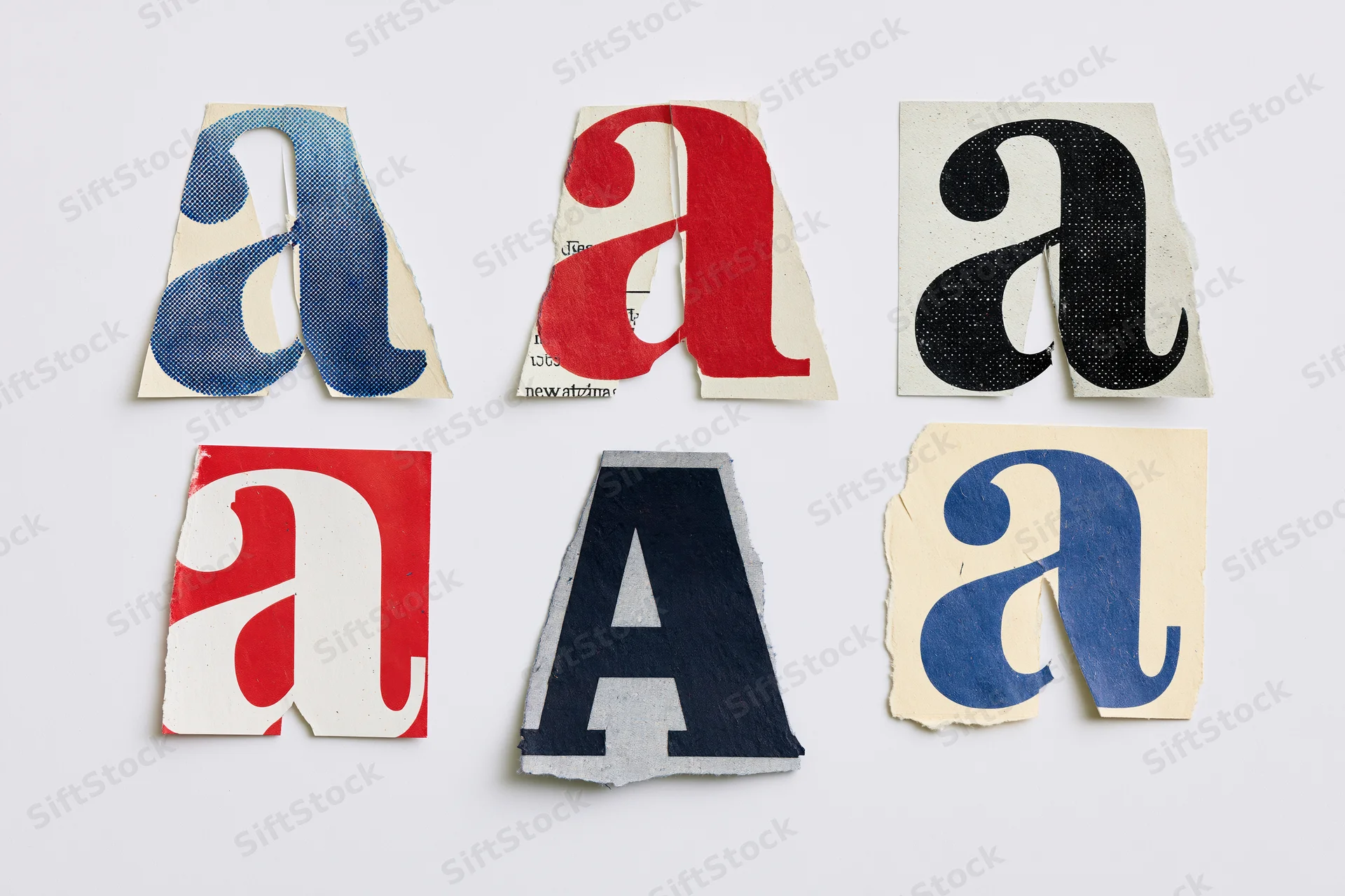 Six cut-out magazine letter a clippings arranged in two rows on white background