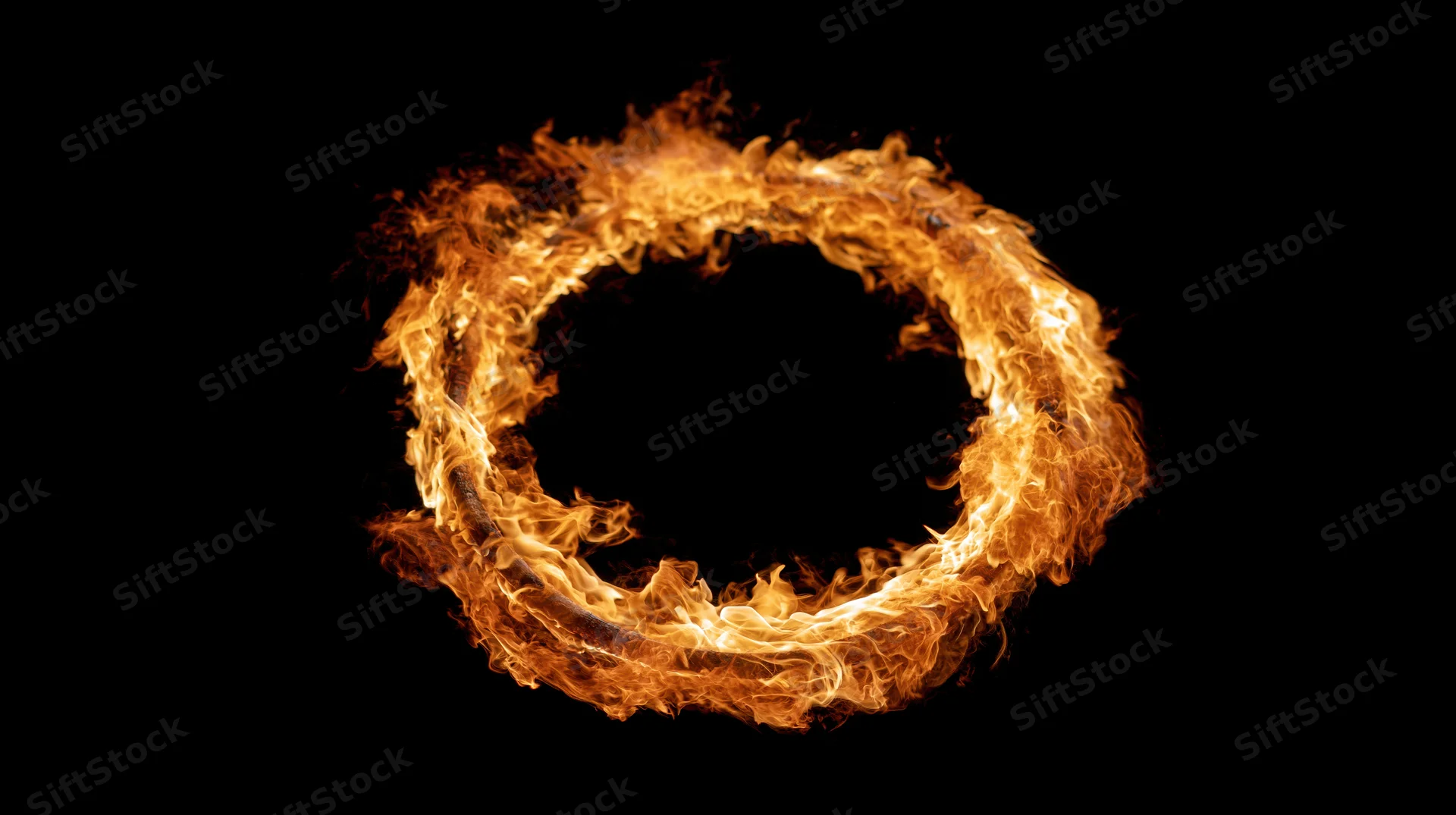 Circular ring of fire burning in a complete loop against black background