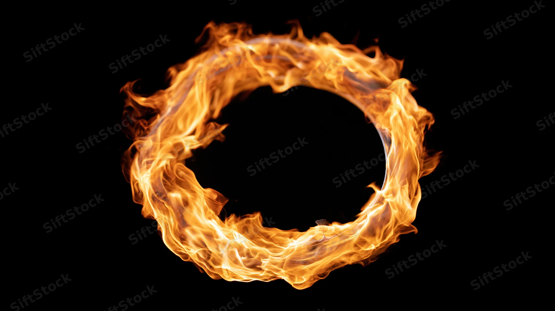 Circular ring of fire burning in a loop against black background