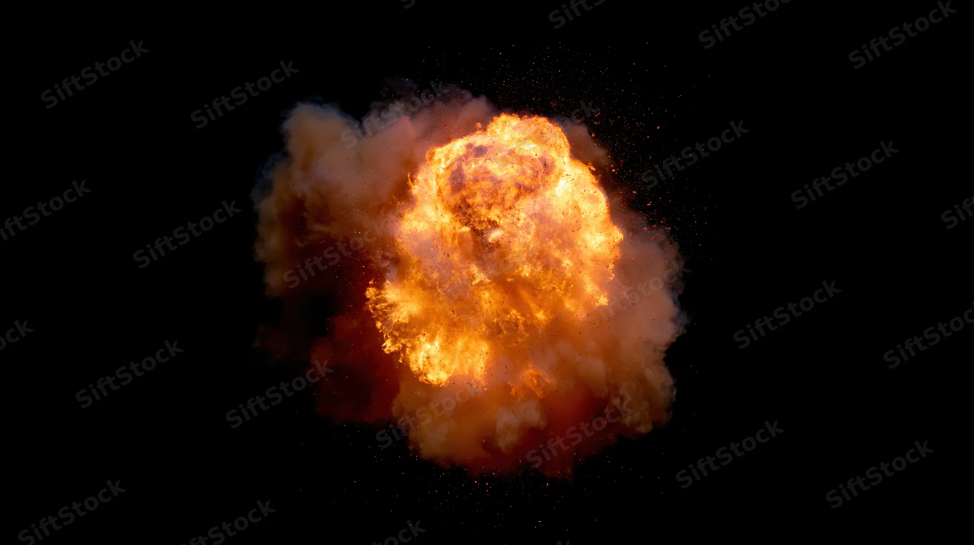 Glowing fireball exploding in mid-air against black background