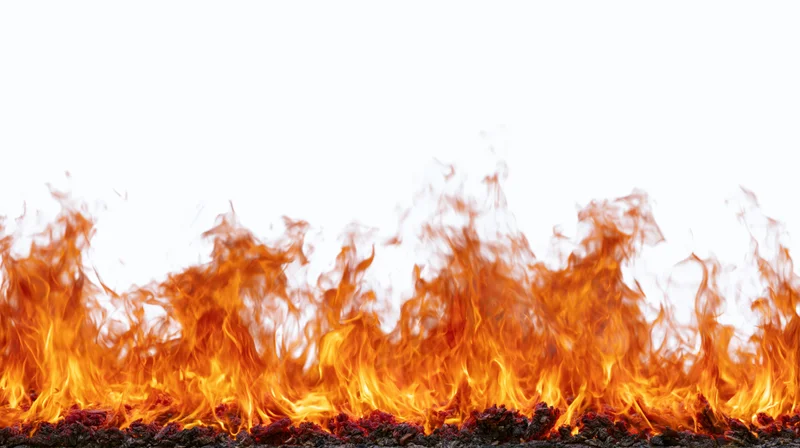 Horizontal band of intense fire flames burning across the bottom against a white background