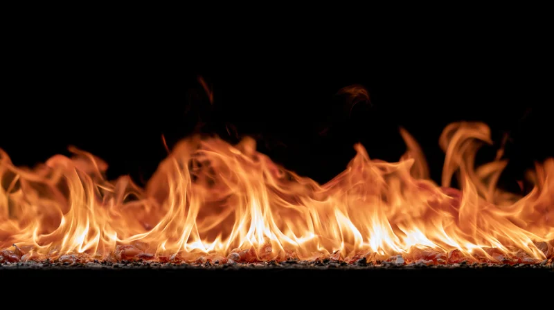 Horizontal band of flames burning across a black background