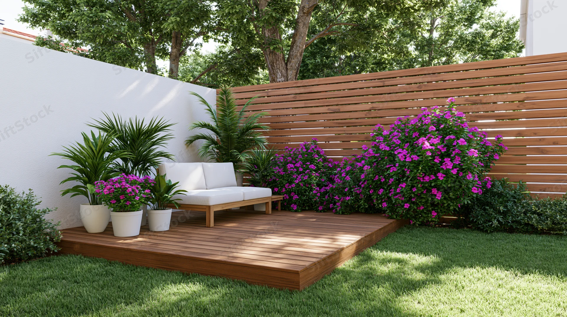 Modern wooden deck with white sofa and potted plants in a residential backyard garden