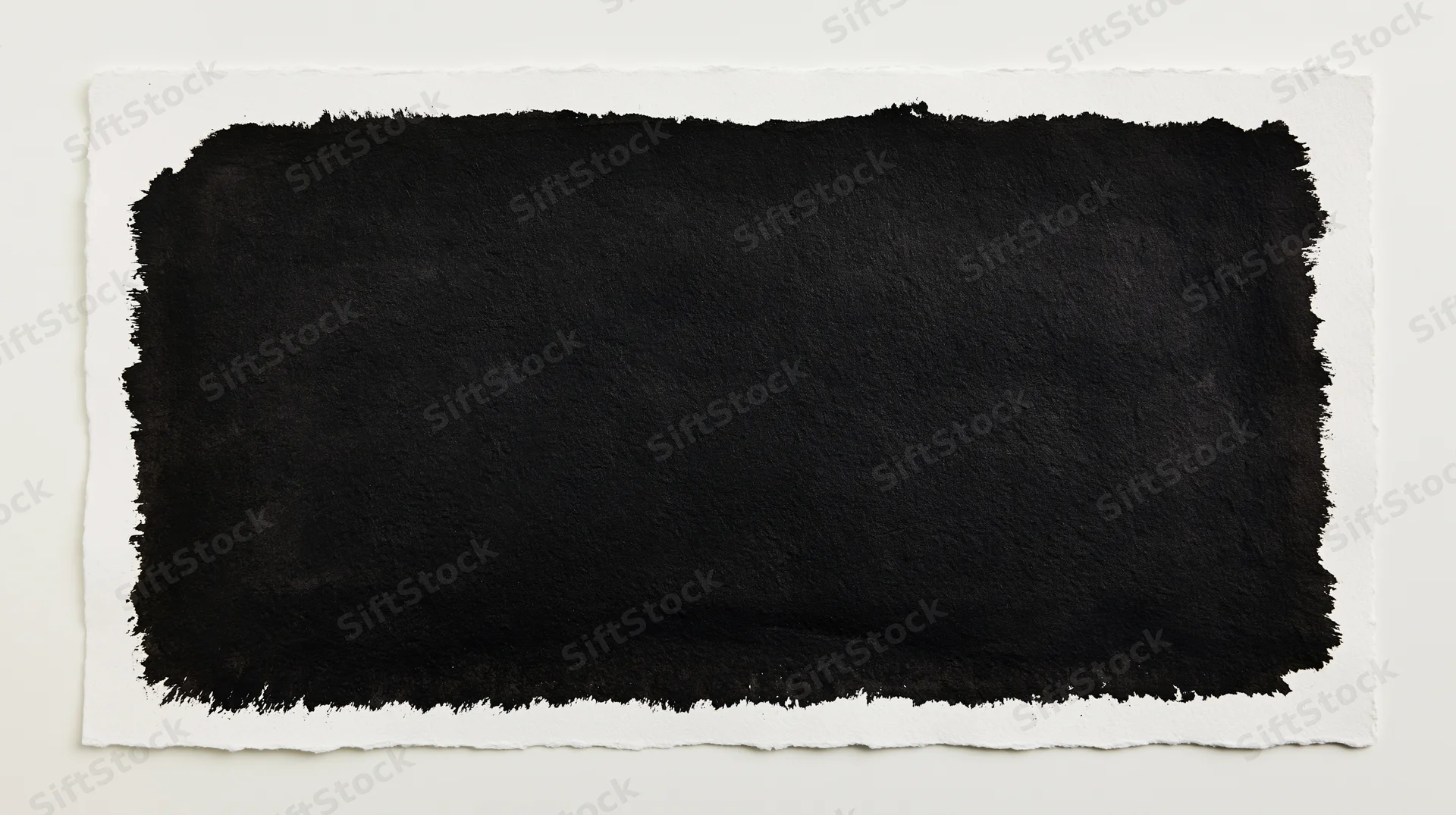 Black ink wash painted on white paper with torn edges