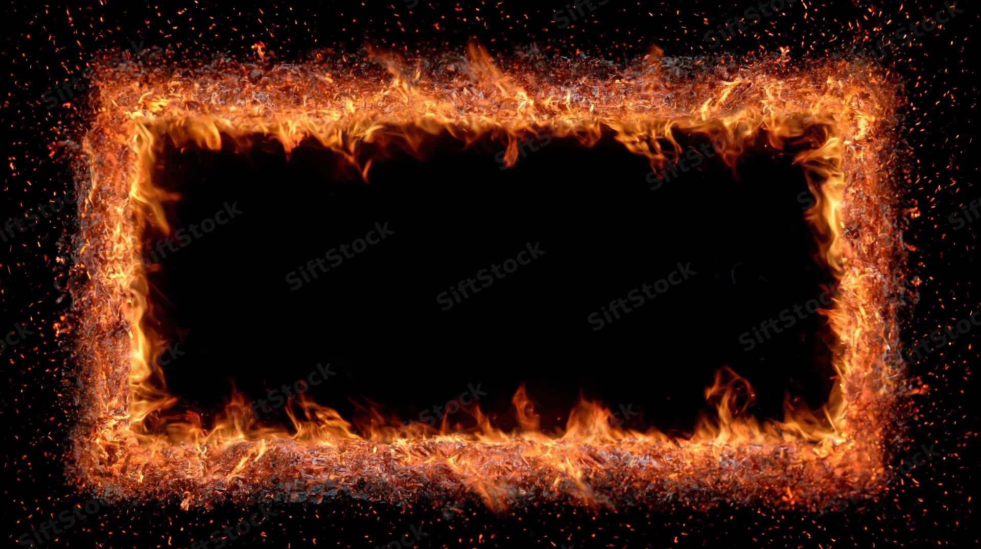 Rectangular frame of burning fire and glowing embers on black background with copyspace