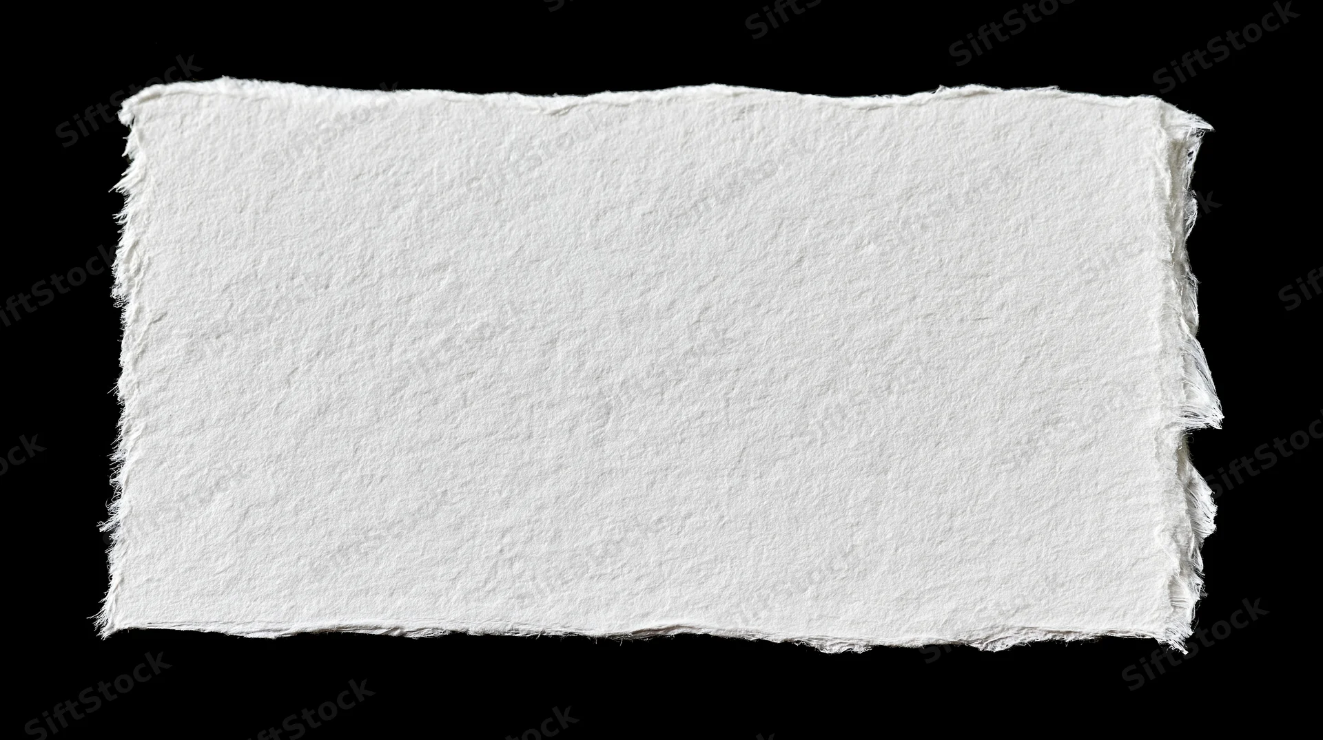 Torn white paper sheet with rough edges isolated on black background