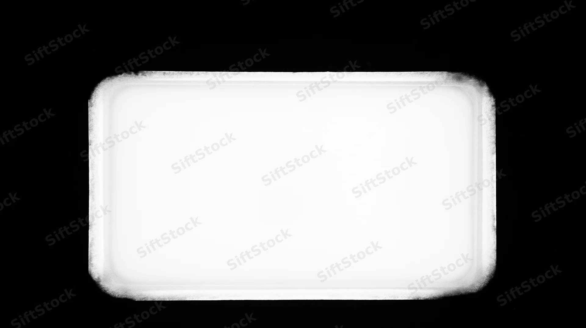 Overexposed blank film frame centered on pure black background