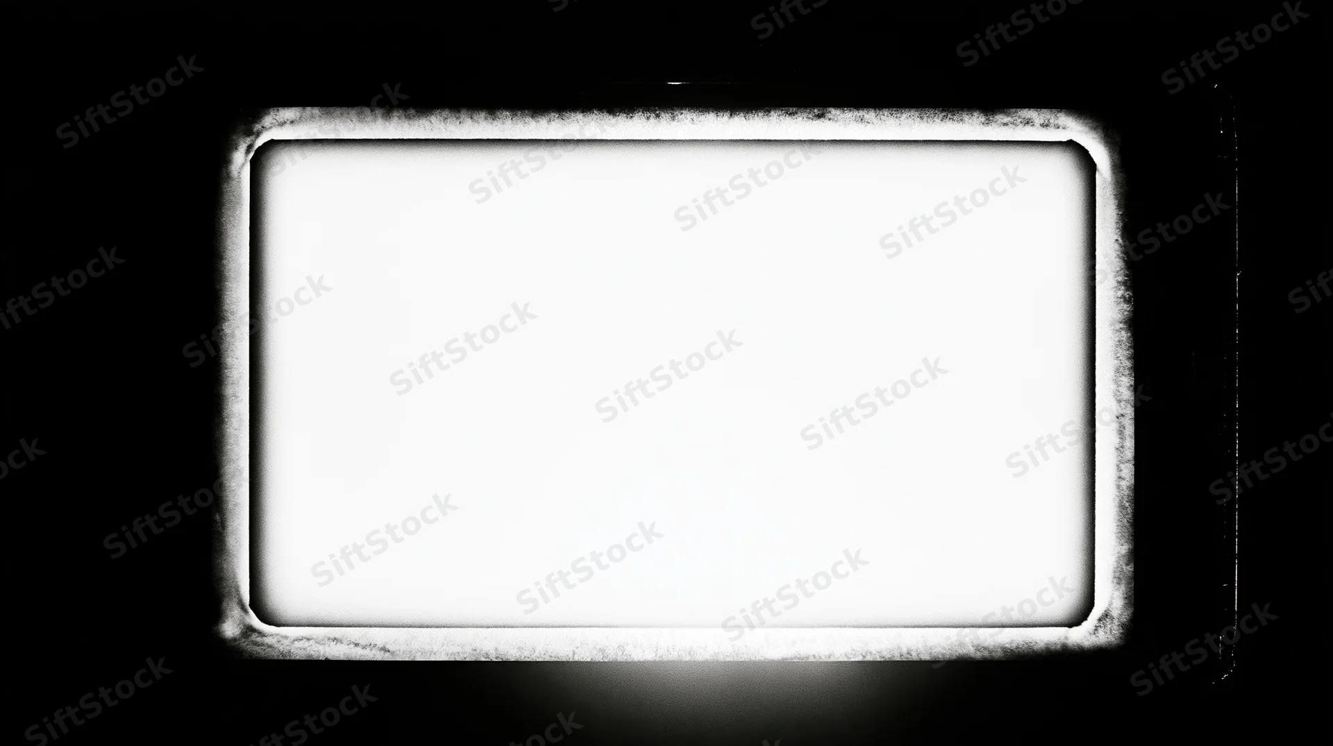 Overexposed blank film frame centered on black background with textured border