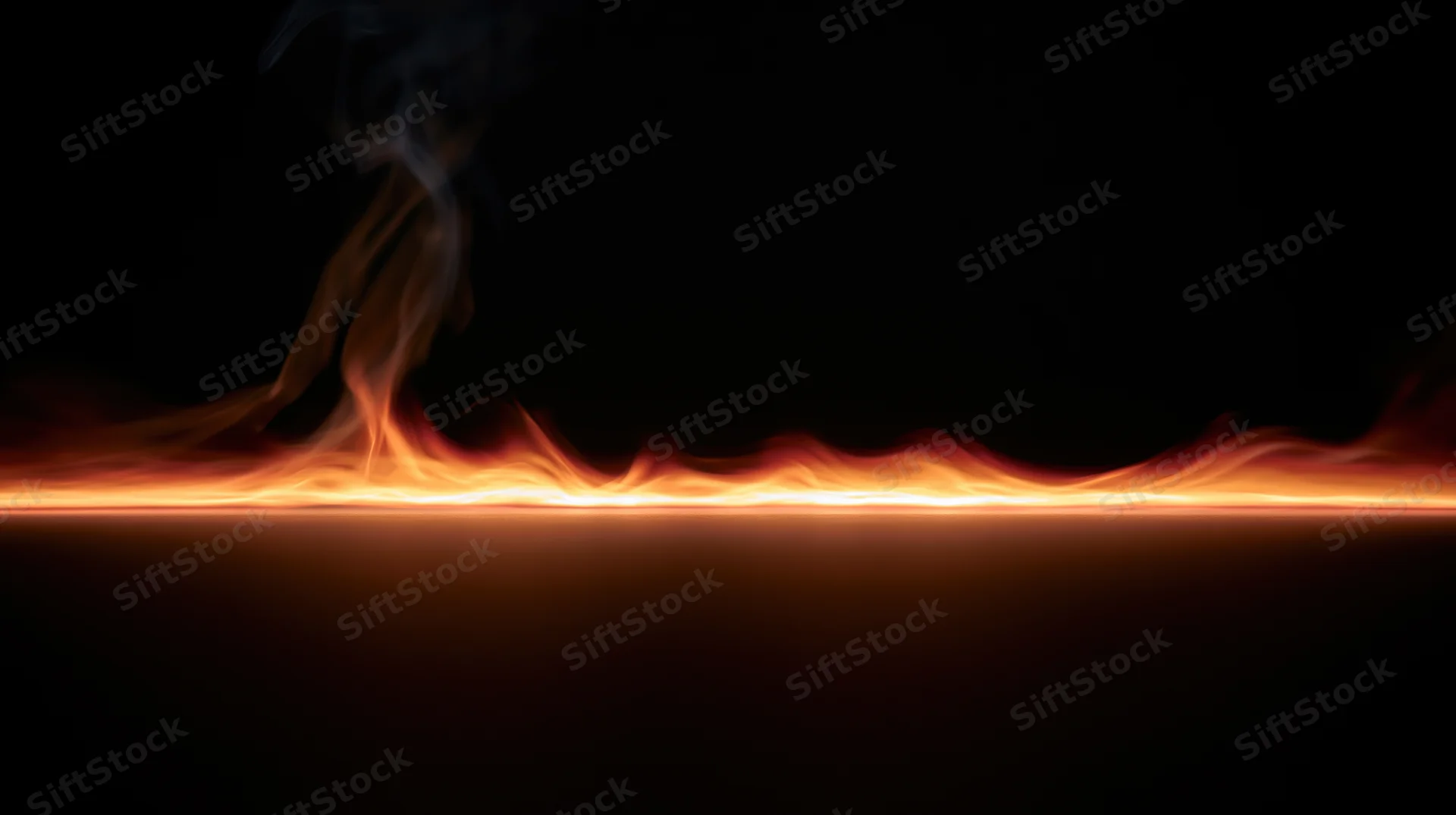 Horizontal line of fire burning across dark background with rising smoke