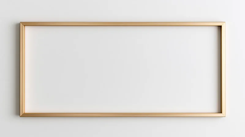 Thin gold rectangular frame lying flat on a white surface with blank interior for mockup use