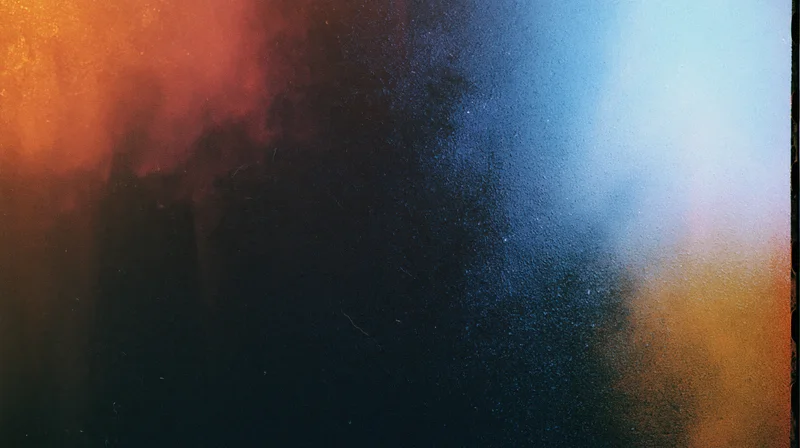 Abstract film texture with color gradients and grainy surface