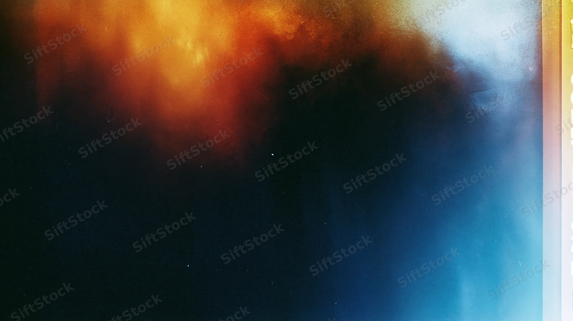 Abstract film texture with warm orange and cool blue gradients blending in a dark frame