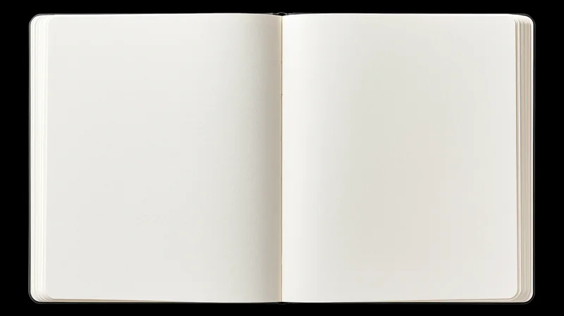 Open blank notebook lying flat with empty white pages on black background
