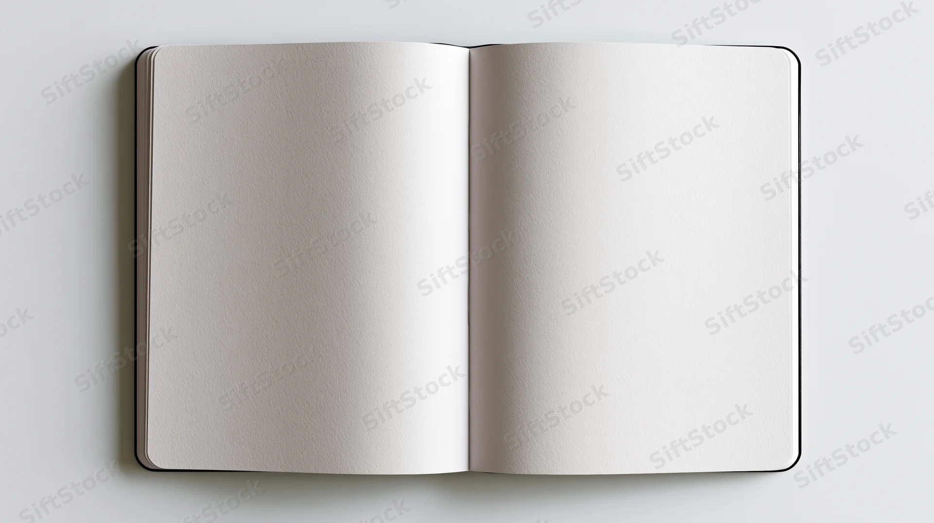 Open blank notebook lying flat on white surface with empty pages for writing or design