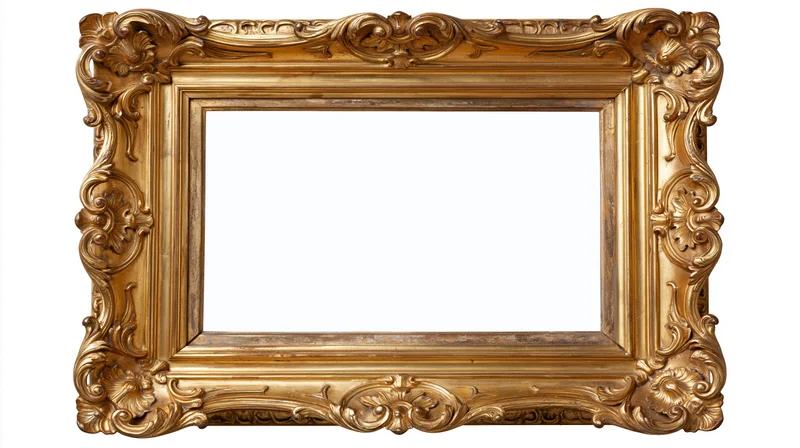 Ornate antique gold picture frame with baroque carved scrollwork isolated on white background