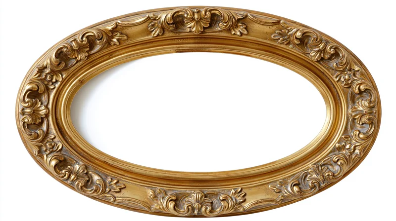 Ornate antique oval frame with baroque carved leaf details isolated on white