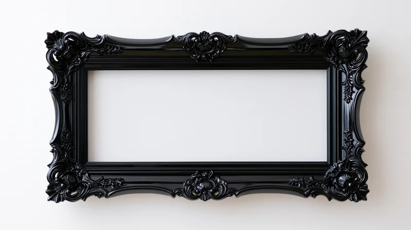 Ornate black baroque-style frame hanging on a white wall with empty center for display