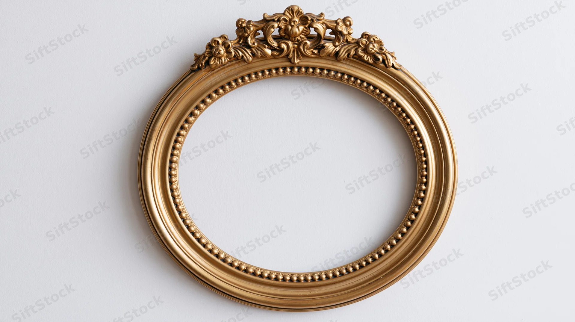 Ornate gold circular frame with baroque carvings on white background