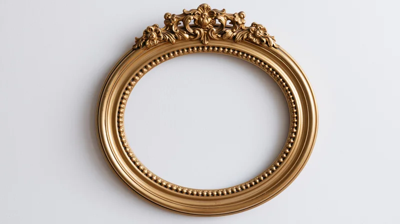 Ornate gold circular frame with baroque carvings on white background