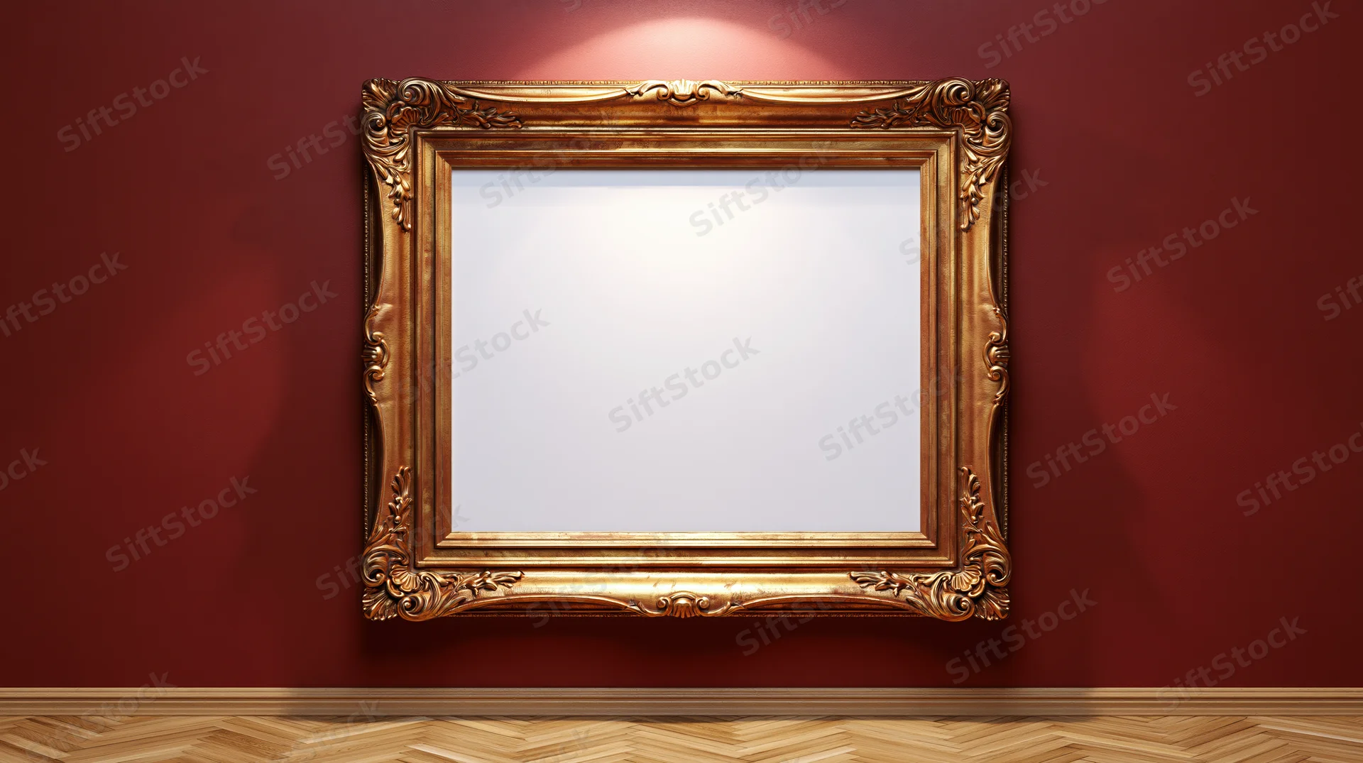 Ornate gold baroque frame with blank white interior hanging on red wall above herringbone wood floor