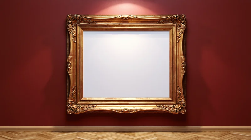 Ornate gold baroque frame with blank white interior hanging on red wall above herringbone wood floor
