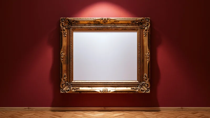Ornate gold baroque frame with blank white interior hanging on red wall in gallery space