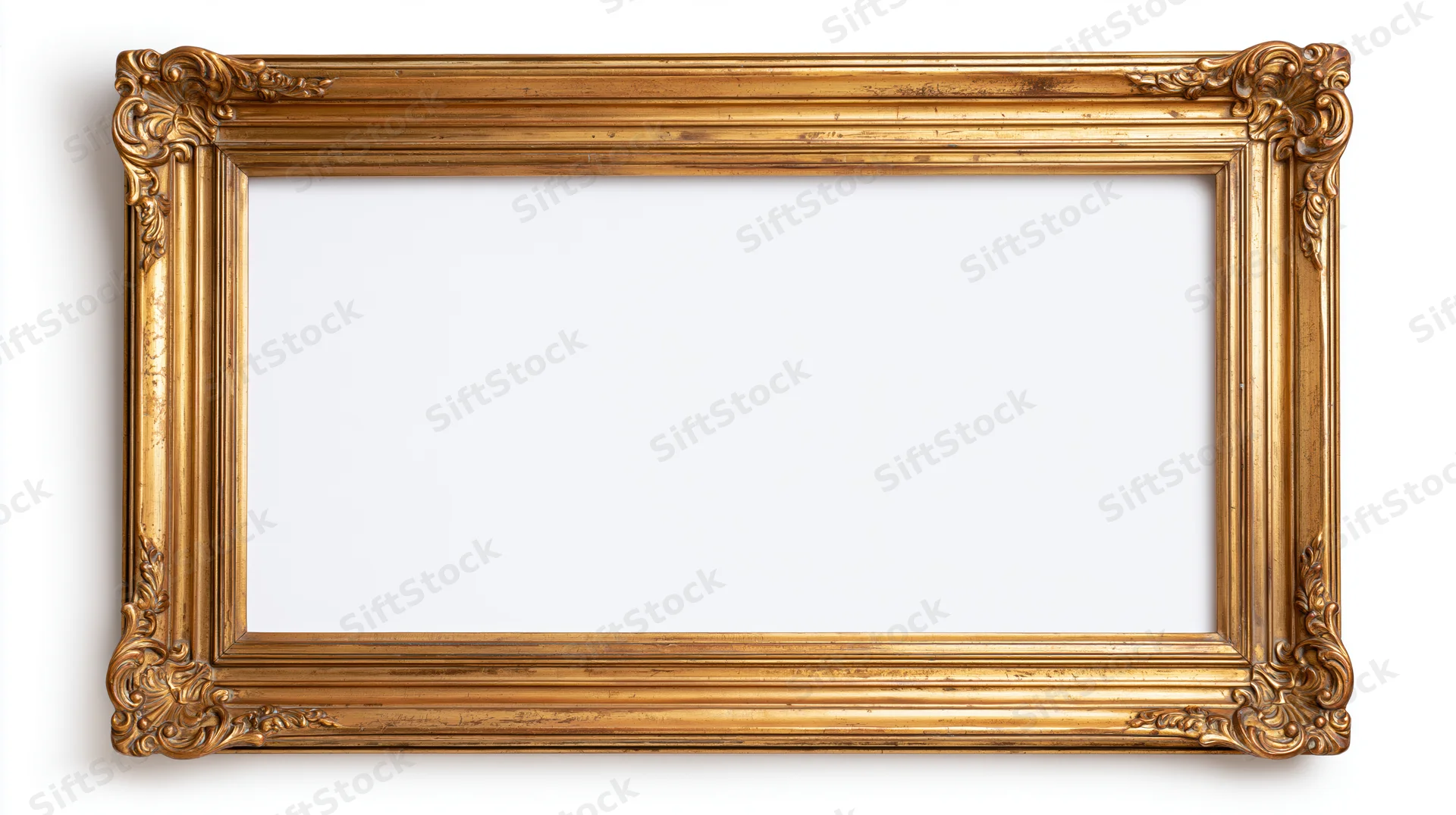 Ornate gold picture frame with carved corners and fluted molding isolated on white background