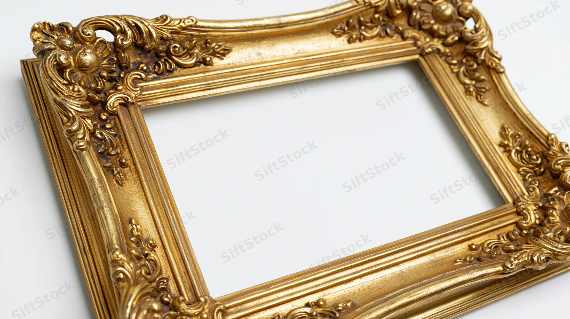 Ornate gold baroque frame with carved scrollwork on white background